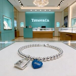 Tiffany & Co. Silver Bracelet with Blue Heart Charm